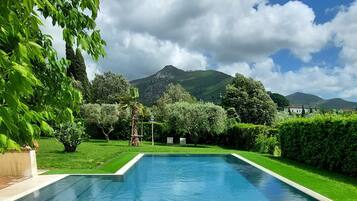 Seasonal outdoor pool, open 9:00 AM to 7:00 PM, pool umbrellas