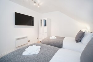 2 bedrooms, individually decorated, individually furnished, desk