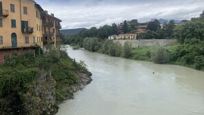 A river flowing through a town with buildings on both sides. - Remarkable 6 Bedrooms Villapiemonte With Land (Cerrione)