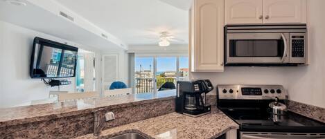 Microwave, dishwasher, coffee/tea maker, cookware/dishes/utensils