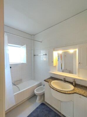 Hair dryer, bidet, towels, toilet paper