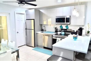 Microwave, stovetop, toaster, cookware/dishes/utensils