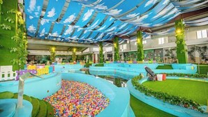 An indoor play area with a ball pit, slides, and a sky ceiling. - Yanling Bloom Hot Spring Hotel (Yanling)