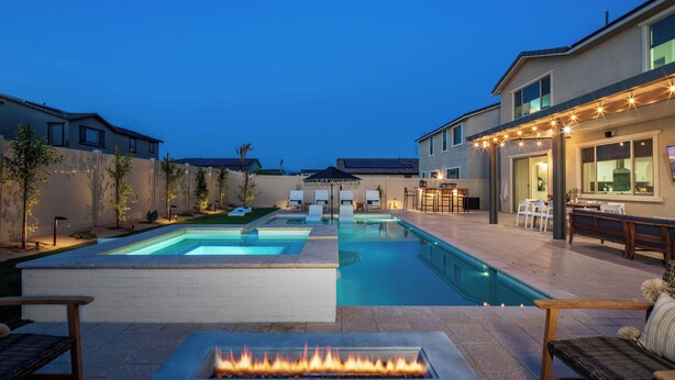 A backyard with a swimming pool, outdoor seating, and a fire pit. - 2 Mi. To Coachella Festival - Pool, Spa, Gameroom (Coachella)
