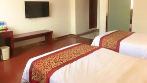 A hotel room with two beds, a TV, a bench, and a trash bin. - Greentree Inn Suzhou Wuzhong District Fengjin Road Business Hotel (Suzhou)
