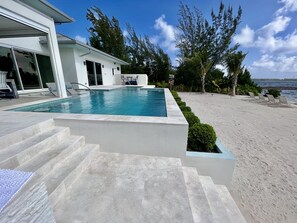 Outdoor pool, a heated pool, pool loungers - Carolina Kai - Beautiful LUXURY villa private beach near Rum Point & Starfish Pt (Rum Point)