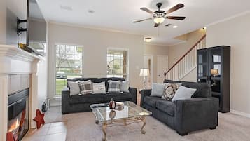 Smart TV, fireplace, books, stereo