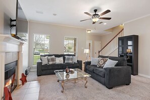 Smart TV, fireplace, books, stereo