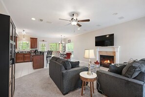 Smart TV, fireplace, books, stereo