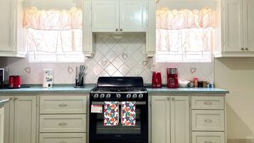 Fridge, microwave, stovetop, coffee/tea maker