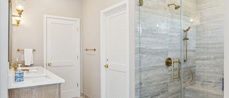 Shower, hair dryer, towels, soap