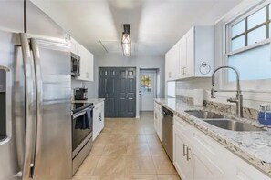Fridge, microwave, oven, stovetop - Trendzy Suite - King Bed/HotTub - Close to Downtown and Foodie Hotspots (Tampa)