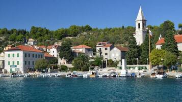 Perched on a hillside, the charming town offers a picturesque view of the waterfront and surrounding greenery.
