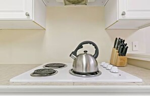 Fridge, microwave, stovetop, coffee/tea maker