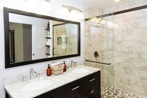 Shower, hair dryer, towels, soap