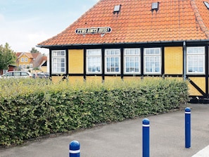 A building with a sign reading 'FYNS AMTS AVIS' and a red-tiled roof. - 4 Person Holiday Home in Aeroskobing (Aeroskobing)