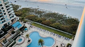 A resort with a pool area, beach access, and ocean views.