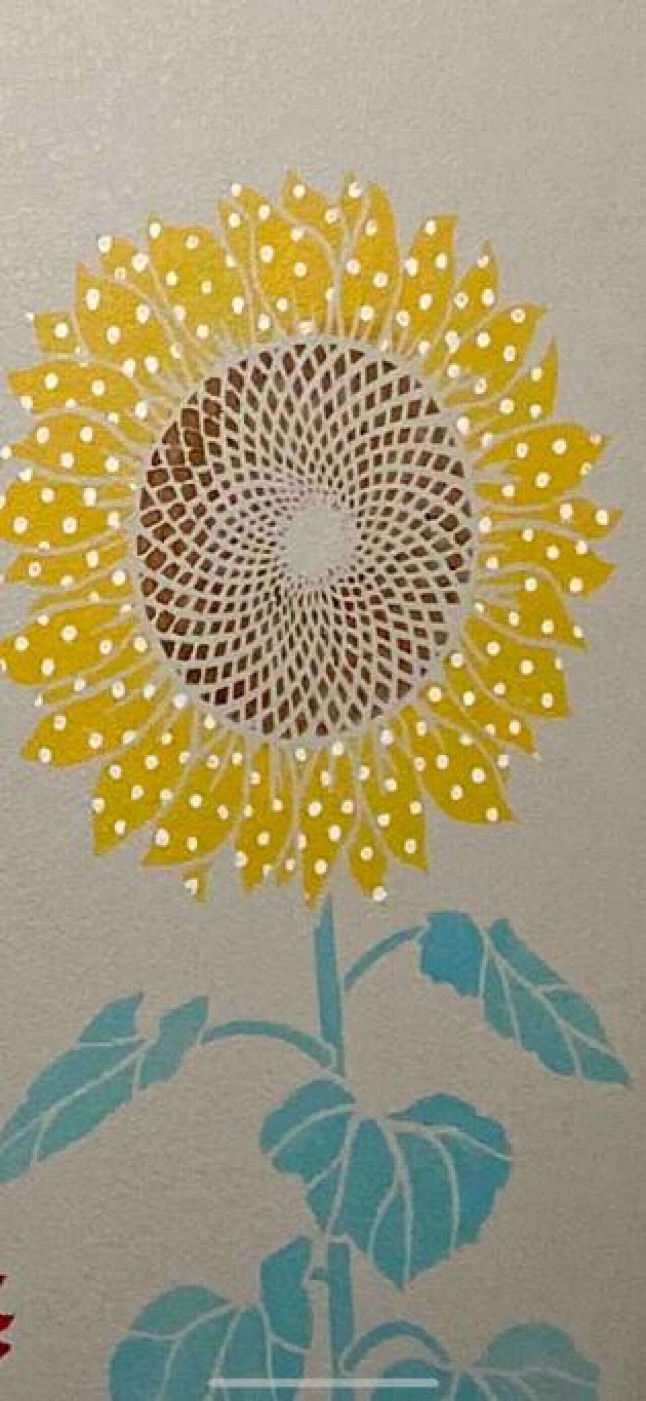 A sunflower with a detailed center and leaves.
