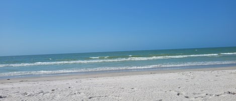 On the beach, sun loungers, beach towels