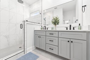 Shower, hair dryer, towels, soap
