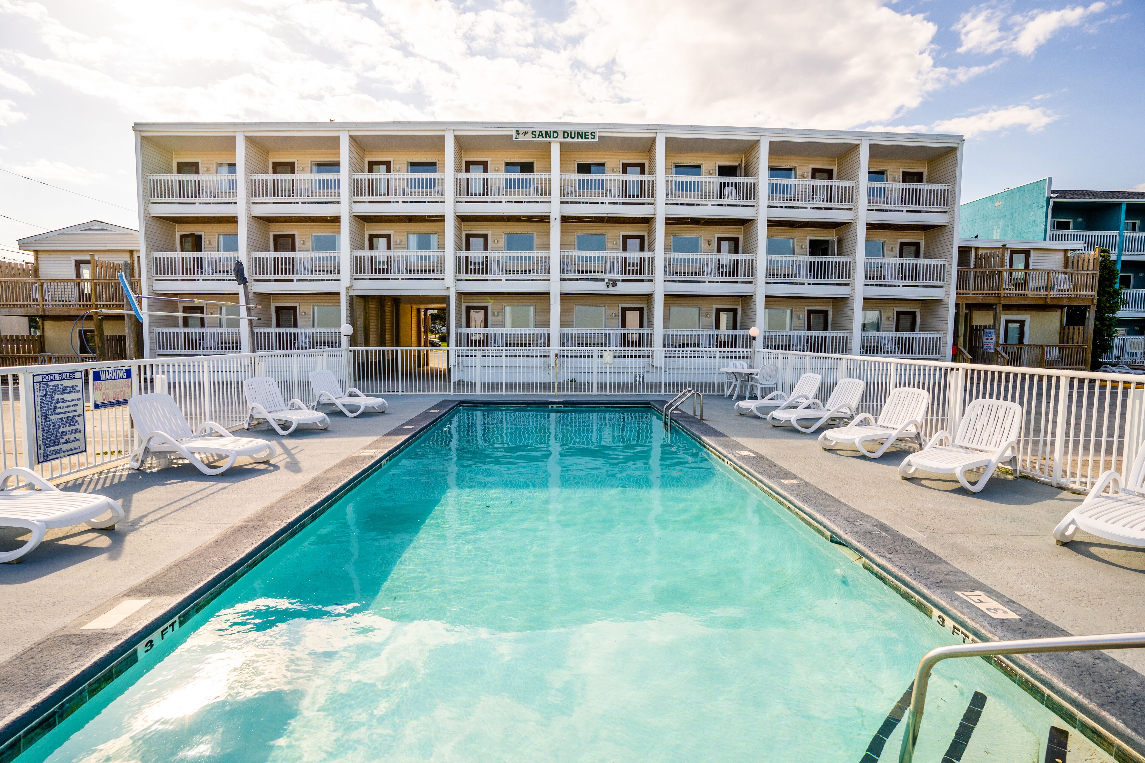 Seasonal outdoor pool, open 8:00 AM to 8:00 PM, pool umbrellas