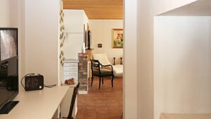 A compact living space with a dining area, a kitchen, and a small seating area. - 8 Person Holiday Home in Storvorde (Storvorde)