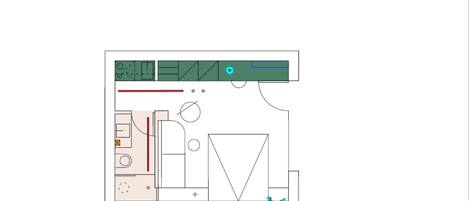 A floor plan of a hotel room with a kitchenette, a bed, a bathroom, and a large window.