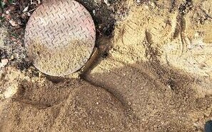 A close-up of a textured surface with a circular pattern, possibly a floor or ground cover. - 5 Star Holiday Home in Stroby (Strøby)