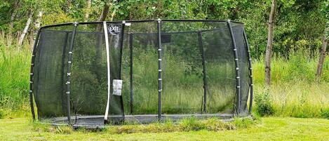 A fenced enclosure with a sign indicating an exit.