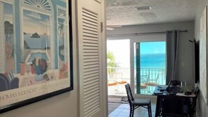 A hallway leading to a balcony with a view of the ocean. - Beachfront~ Unforgettable view! (Panama City Beach)