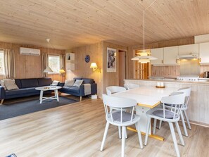 A modern cabin interior with a living area, dining space, and kitchen. - 6 Person Holiday Home in Fjerritslev (Fjerritslev)