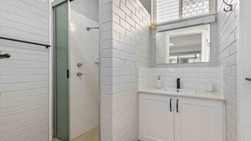 Shower, hair dryer, towels