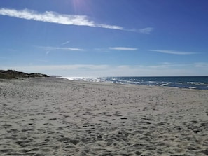 A sandy beach with a clear sky and ocean waves. - 4 Star Holiday Home in Frederiksvaerk (Frederiksvaerk)