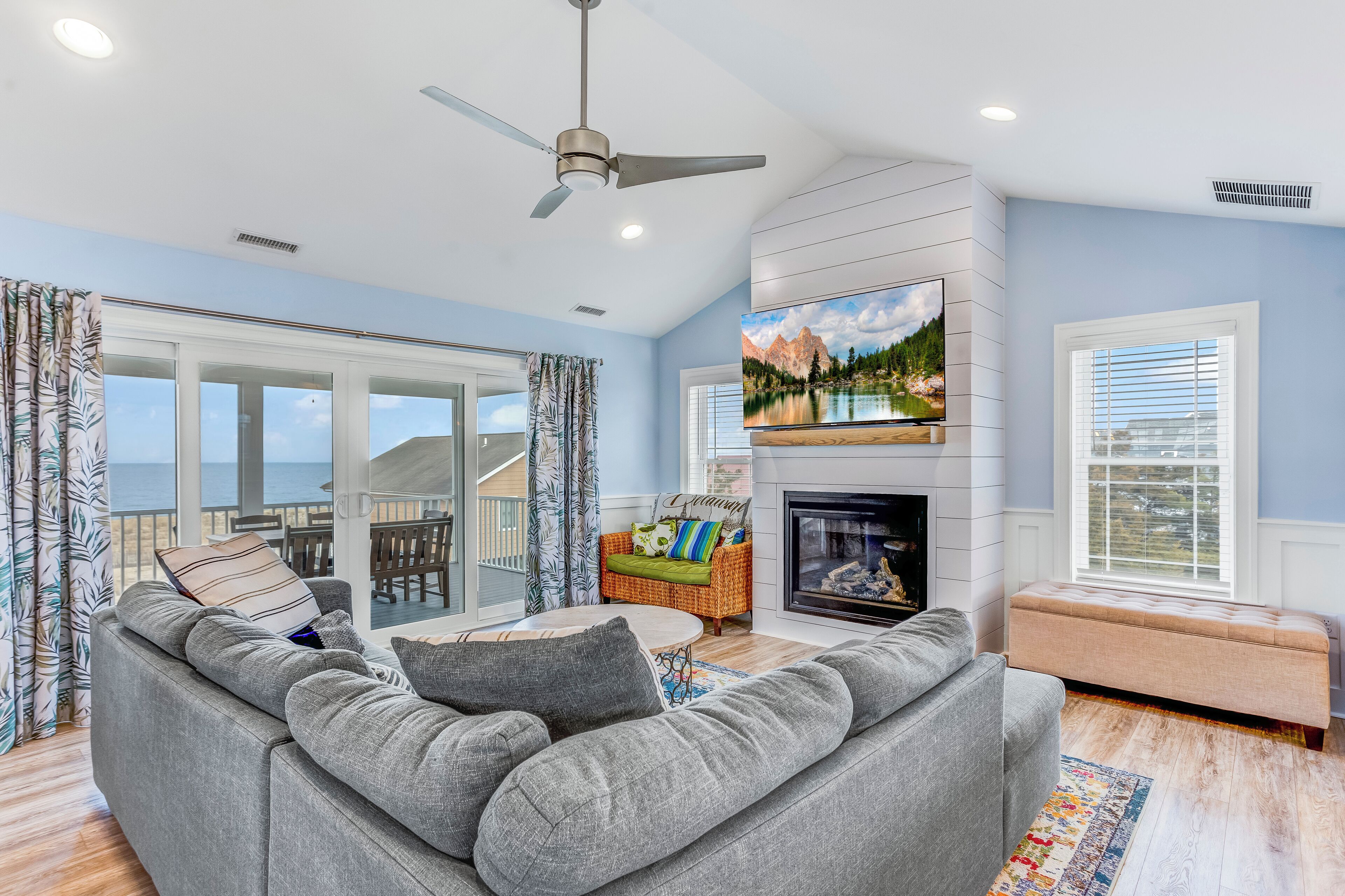 Smart TV, fireplace, books, computer monitors