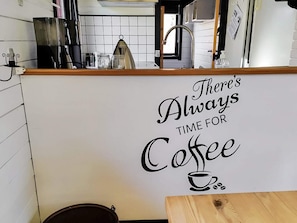 A kitchen area with a sign that reads 'There's Always Time for Coffee.' - 4 Person Holiday Home in Nibe (Nibe)