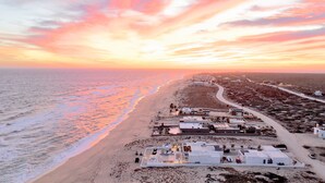 A coastal resort with beachfront villas, a sandy beach, and a clear view of the ocean. - Mexico,Oceanfront vacation villa,Lighthouse Point, near Costa Palmas, private (La Ribera)