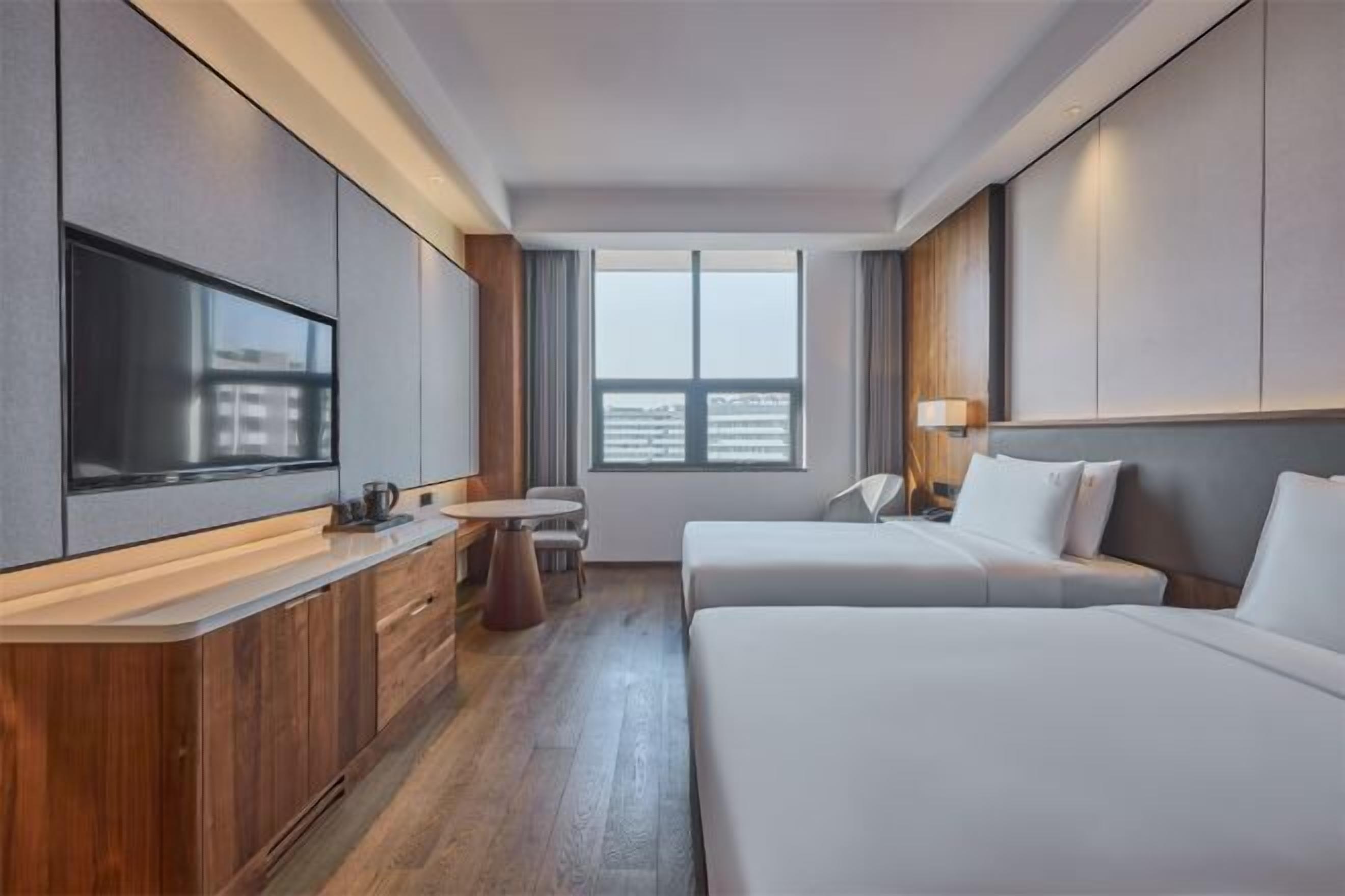 Premium bedding, down comforters, pillowtop beds, minibar