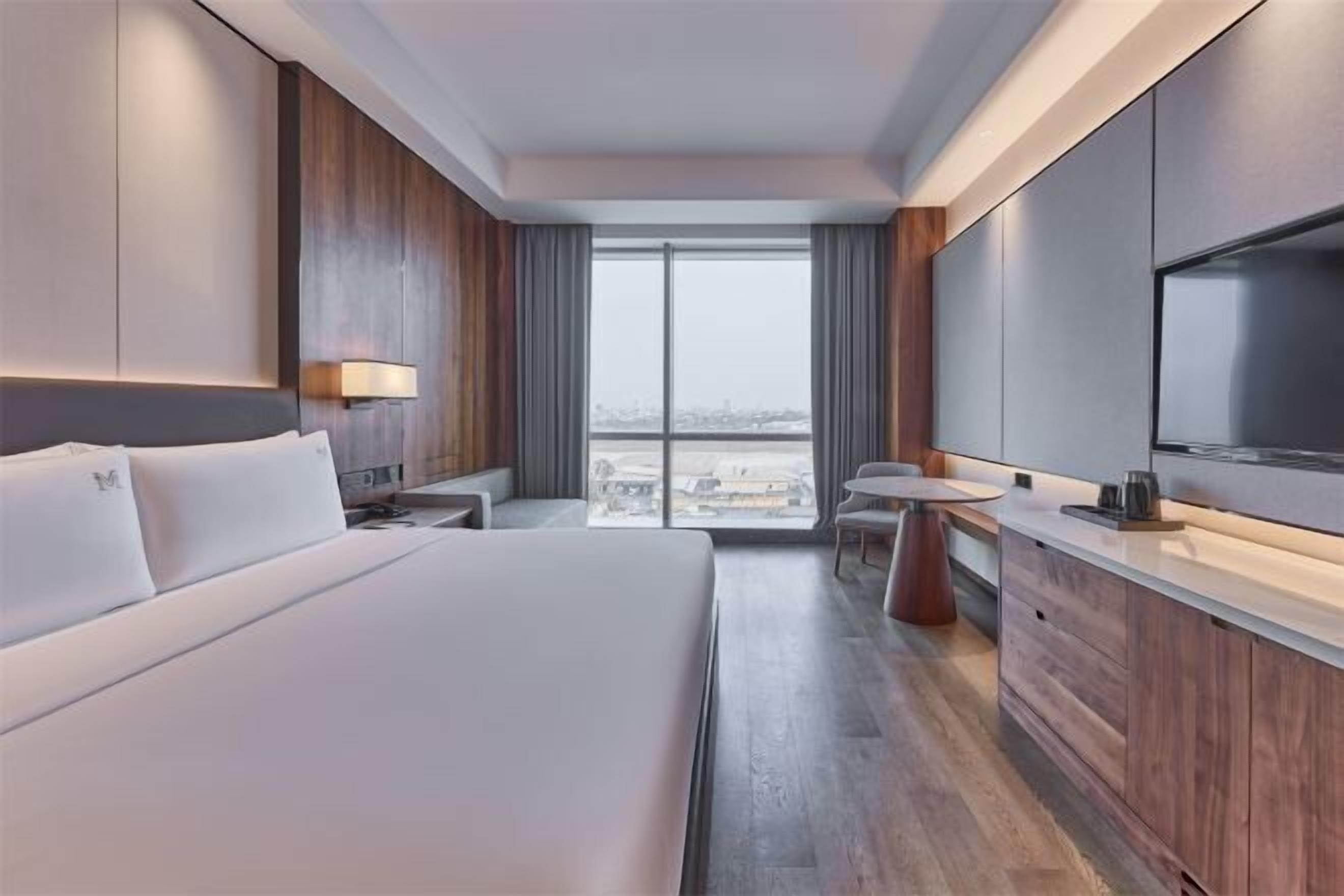 Premium bedding, down comforters, pillowtop beds, minibar