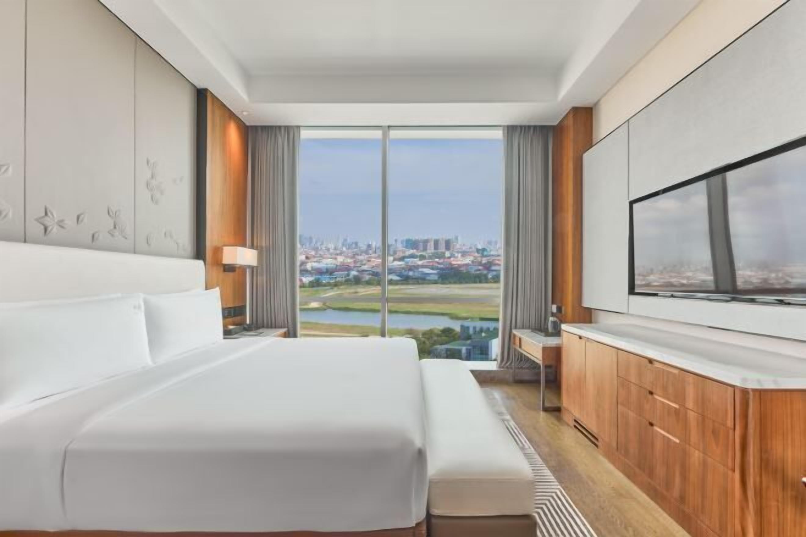 Premium bedding, down comforters, pillowtop beds, minibar