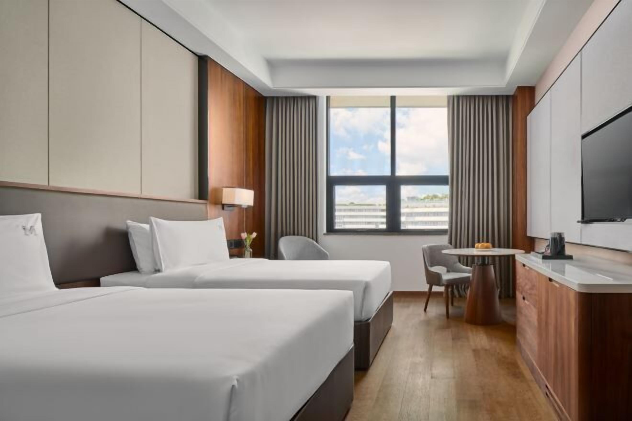 Premium bedding, down comforters, pillowtop beds, minibar