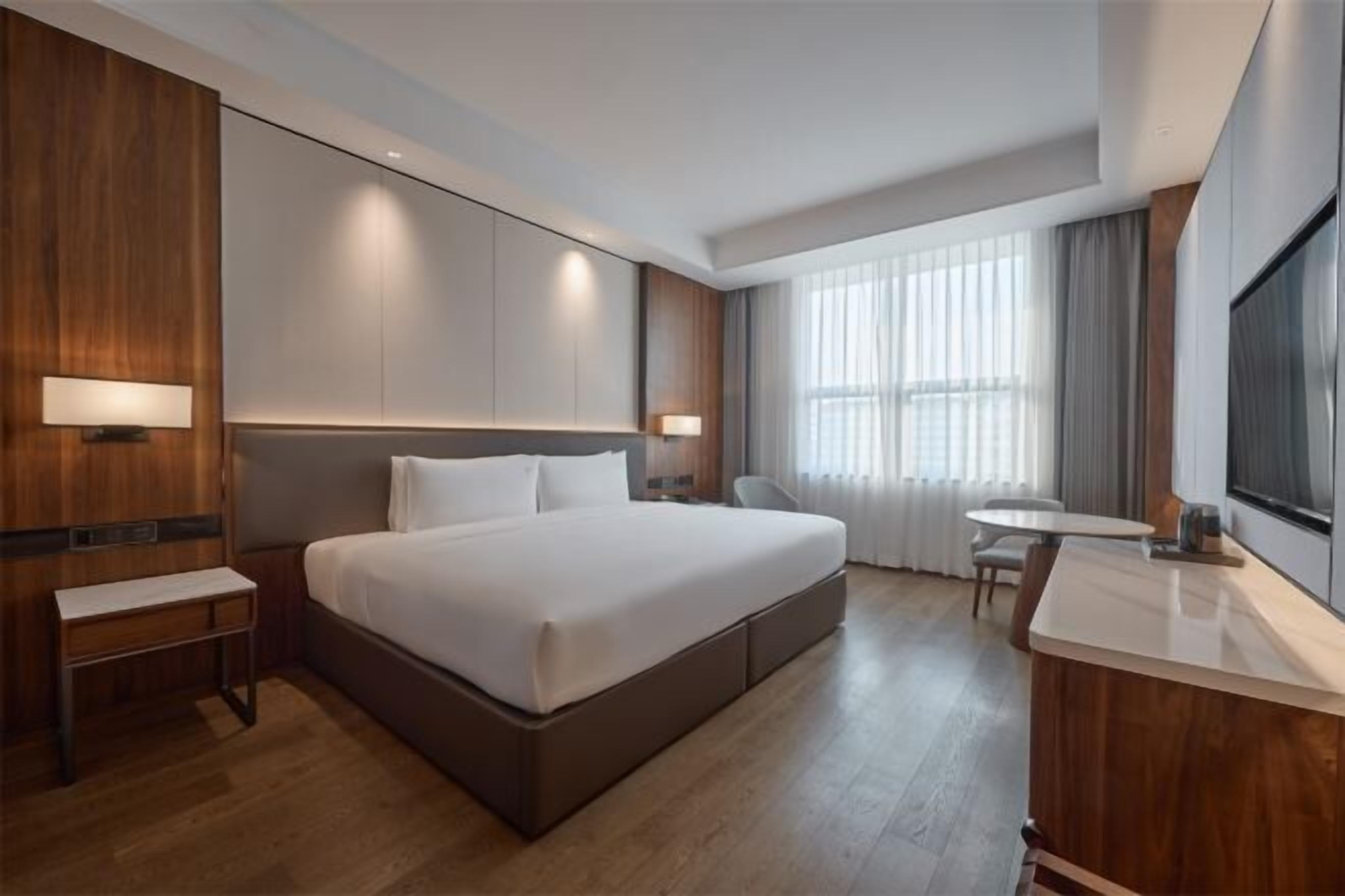 Premium bedding, down comforters, pillowtop beds, minibar