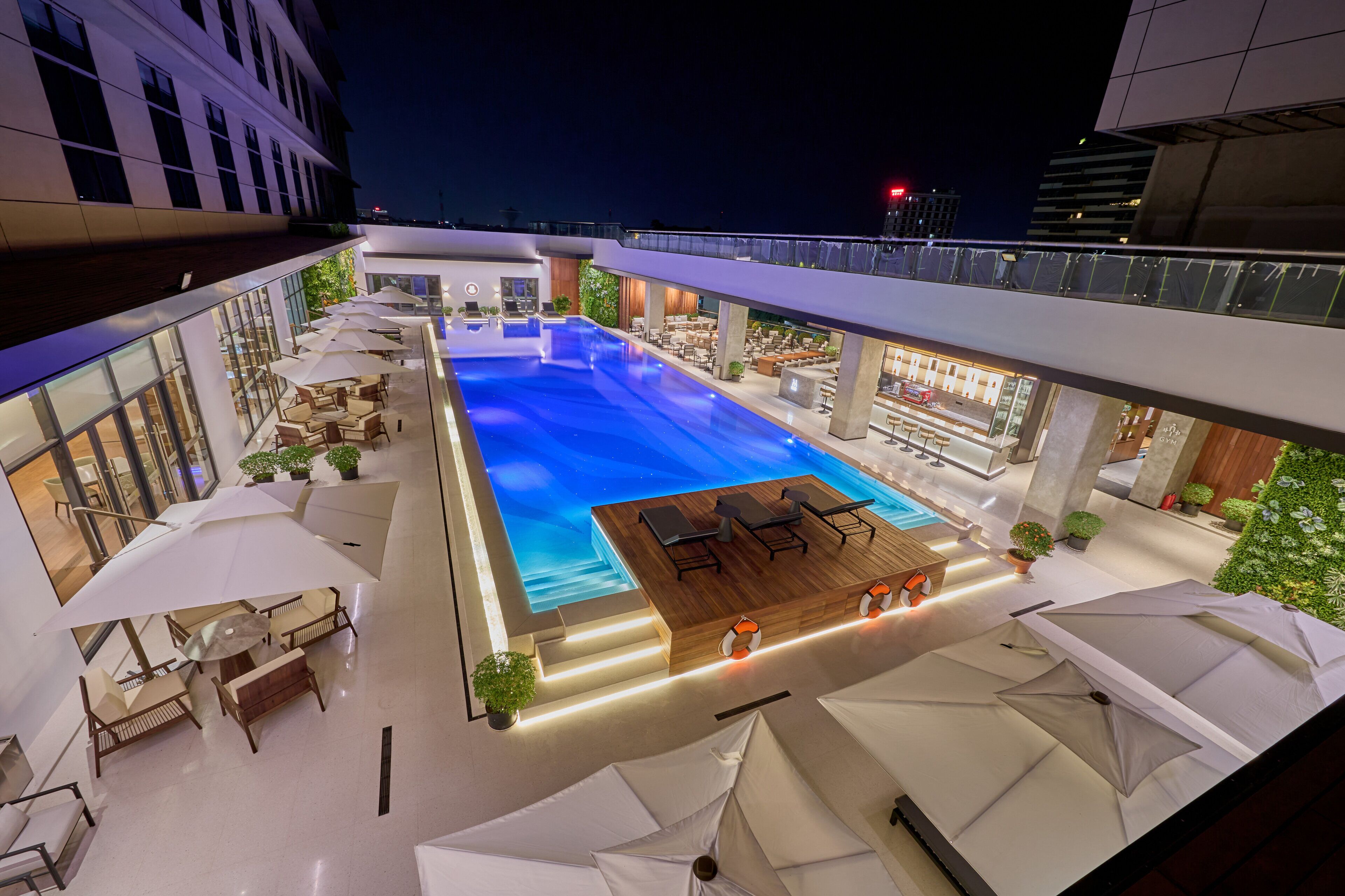 Outdoor pool, open 6:00 AM to 10:00 PM, pool umbrellas, pool loungers