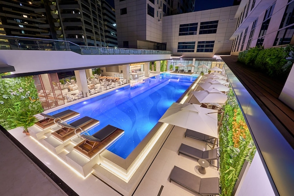 Outdoor pool, open 6:00 AM to 10:00 PM, sun loungers