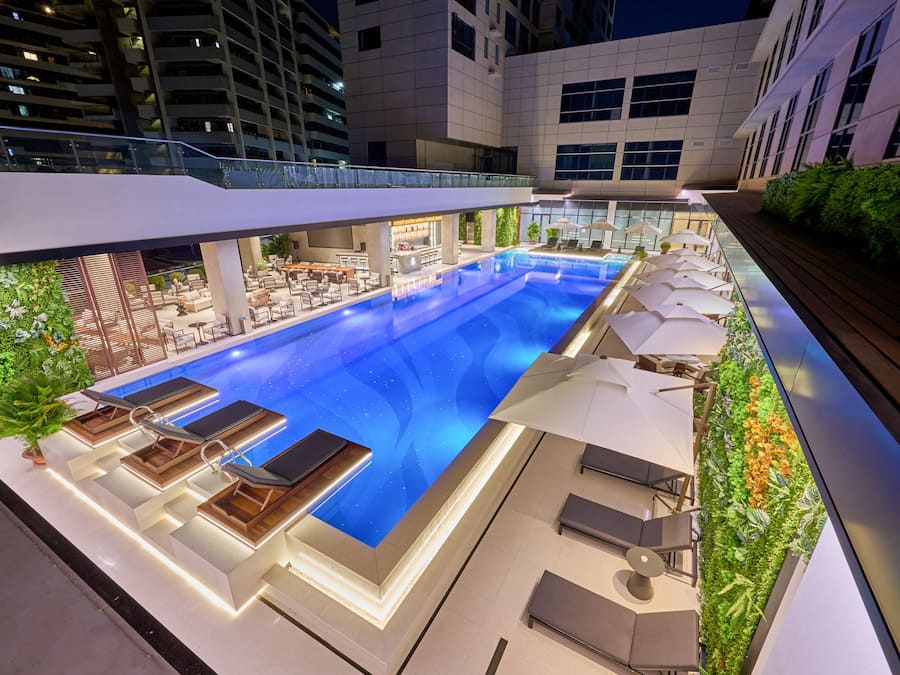 Outdoor pool, open 6:00 AM to 10:00 PM, pool loungers