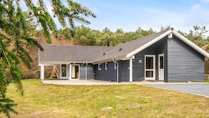 A modern two-story house with a covered porch, a garage, and a number '12' sign. - 4 Star Holiday Home in Ebeltoft (Ebeltoft)