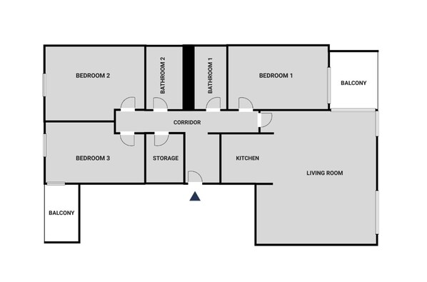 A floor plan with three bedrooms, two bathrooms, a kitchen, a living room, a storage area, and two balconies.