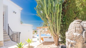 A white building with a staircase and a pool area. - CostaBlancaDreams - Casa Juleo in Benissa (Benissa)
