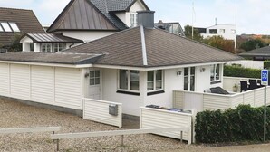 A residential property with a sloped roof, a gated entrance, and a paved driveway. - 5 Star Holiday Home in Esbjerg V (Esbjerg)