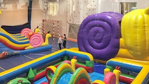 An indoor play area with inflatable slides, tunnels, and various play structures. - 4 Star Holiday Home in Thyboron (Thyborøn)