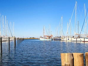 A marina with multiple boats docked at wooden piers. - 5 Star Holiday Home in Wendtorf (Wendtorf)